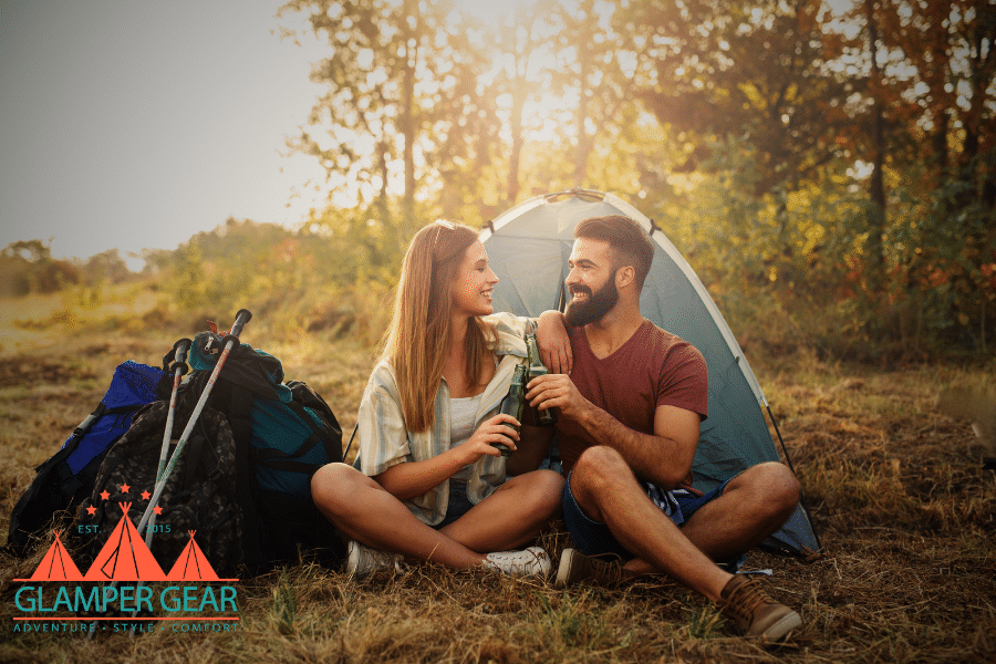 Couple Relaxing Next to a Tent